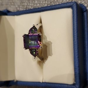 Mystic Topaz ring with an emerald cut center and a pear on each side
